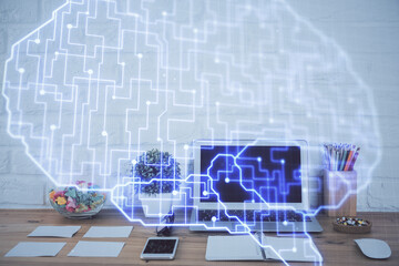 Double exposure of work space with computer and human brain drawing hologram. Brainstorm concept.