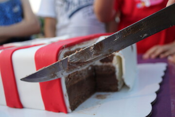 cutting a piece of chocolate