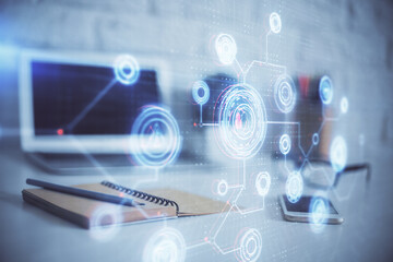 Double exposure of desktop computer and technology theme hologram. Concept of software development.