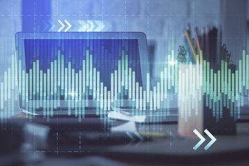 Stock market chart hologram drawn on personal computer background. Multi exposure. Concept of investment.