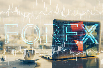 Double exposure of forex graph and work space with computer. Concept of international online trading.