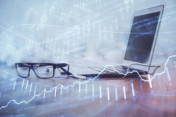 Forex Chart hologram on table with computer background. Multi exposure. Concept of financial...