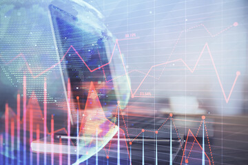 Forex market graph hologram and personal computer on background. Double exposure. Concept of investment.