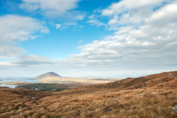 Fototapeta premium View from Diamond hill in Connemara National park, county Galway, Ireland, Bright sunny day, blue cloudy sky.