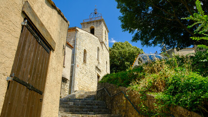 typical rural village in Provence with a bell church