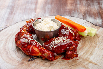 Chicken legs in barbecue sauce with fresh vegetables and tartar sauce