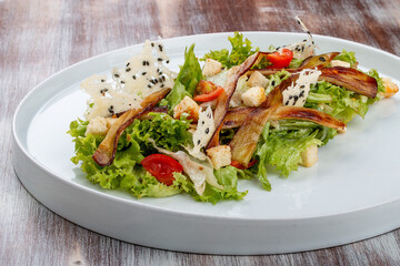Salad with baked eggplant, mozzarella and romaine lettuce