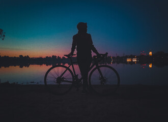 Obraz premium silhouette of a person riding a bike