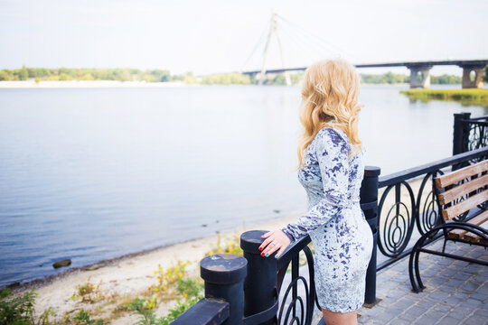 blonde in a blue dress
