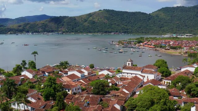 Drone shot over the Paraty town, an old preserved Portuguese colonial on the coast of state of Rio de Janeiro, Brazil - dolly, aerial view
