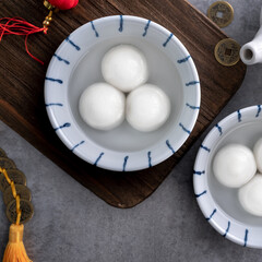 Top view of big tangyuan yuanxiao in a bowl on gray background for lunar new year food.