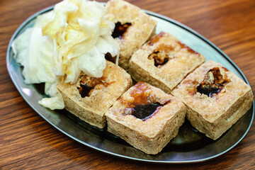 Deep fried stinky tofu with pickled cabbage, famous and delicious street food in Taiwan.