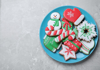 Delicious Christmas cookies on light marble table, top view. Space for text