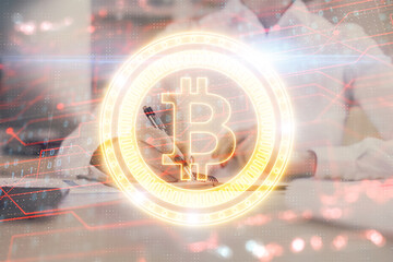 Cryptocurrency hologram, bitcoin, ico theme over hands taking notes background. Concept of blockchain. Multi exposure