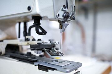 A sewing machine. Concept of equipment for manual work related to professional knowledge and craftsmanship. Selective focus