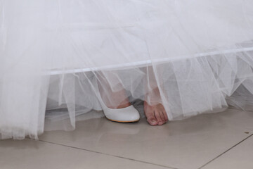 Fototapeta na wymiar White beautiful bride shoes. Wedding details