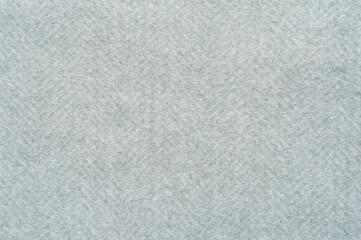Close-up fragment of warm woolen fabric. Concept of warm everyday things.