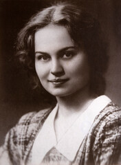 Portrait of beautiful young woman, 1950s archive photo from family album