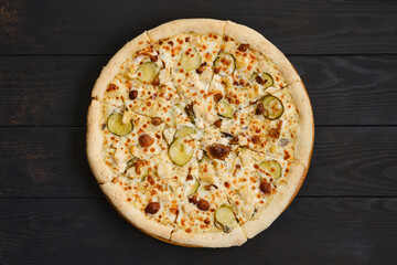 Pizza with chicken, honey mushrooms and pickled cucumber