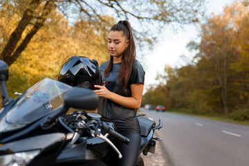 Fototapeta na wymiar Beautiful girl on a sports motorcycle