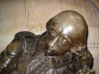 London, UK, June 2, 2009 : William Shakespeare statue unveiled in 1912 at Southwark Cathedral who was an Elizabethan Tudor playwright which is a popular travel destination tourist attraction landmark - Powered by Adobe