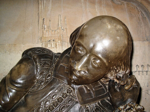 London, UK, June 2, 2009 : William Shakespeare statue unveiled in 1912 at Southwark Cathedral who was an Elizabethan Tudor playwright which is a popular travel destination tourist attraction landmark