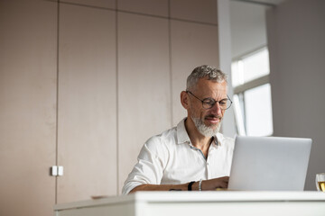 Determined specialist pressing the buttons on a keyboard