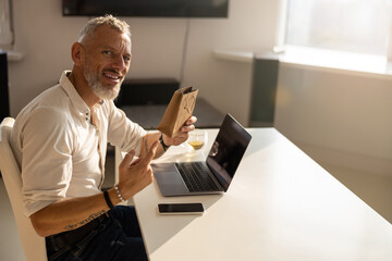 Proud man is displaying a tiny package