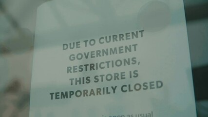 Slow motion shot of independent shop closed until further notice due to the COVID 19 coronavirus pandemic, bars, cafes, restaurants, clubs all shut cause of this international crisis lockdown 2.0 