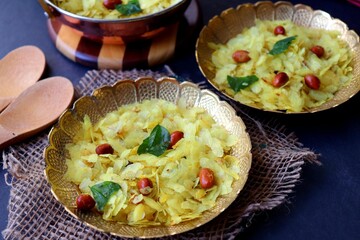 Poha Chivda or Chiwada. Diwali special savory snack, made out of Flattened rice, fried peanuts, curry leaves and some spices. Traditional Indian Diwali Snacks.  with Copy Space.