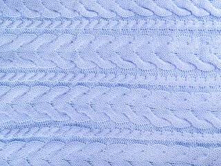 Beautiful wool knitted background in pale blue color.