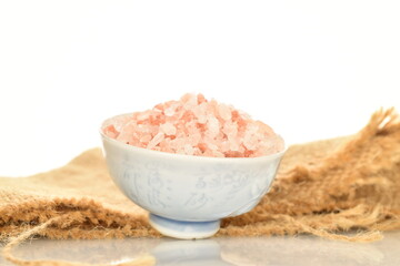 Himalayan salt, close-up, isolated on white.