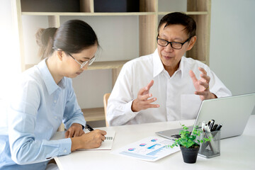 A businessman mentor and intern  woman staff