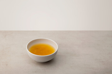 Yuzu tea or yuja tea is a popular asian citron tea made by mixing hot water with yuja-cheong (yuja marmalade). Selective focus, copy space