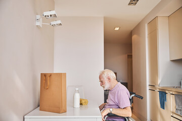 Elderly person dozing off in the wheelchair