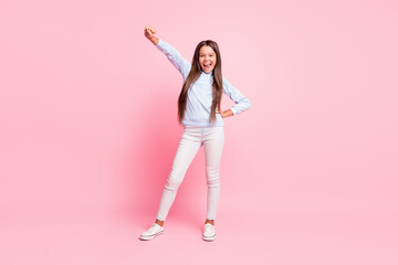 Fototapeta na wymiar Full length body size view of attractive slender glad cheerful girl dancing celebrating isolated over pink pastel color background
