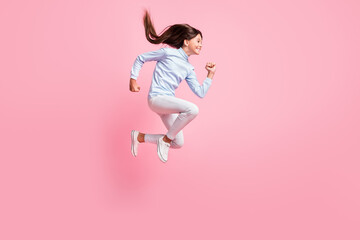 Fototapeta na wymiar Full length body size view of pretty motivated cheerful girl jumping running fast speed energy isolated over pink color background