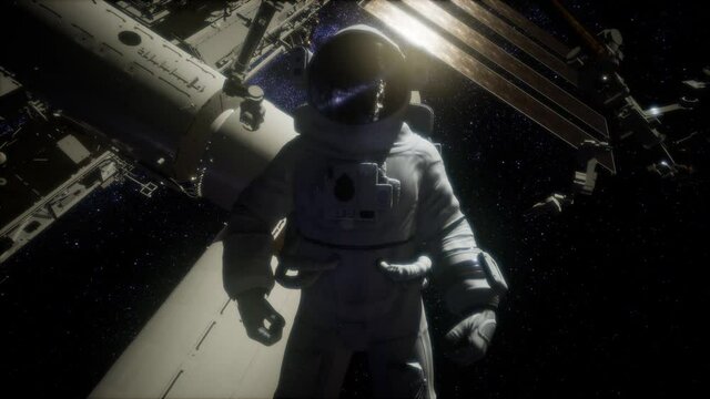 Astronaut outside the International Space Station on a spacewalk. Elements of this image furnished by NASA