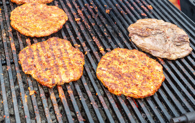 Pieces of grilled meat cooked on the grill