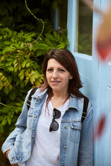 photograph of a woman posing in the street in the sun