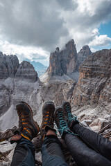 sitting on the edge at unesco world heritage region Dolomites Italy  Tre Cime di Lavaredo