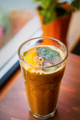 citrus tea with fresh mint in a glass glass. Hot mojito. citrus mulled wine.