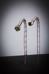 Fototapeta na wymiar very durable and reliable beautiful hydraulic hoses in metal braid