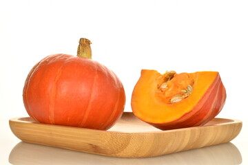 Obraz premium Ripe organic pumpkin, close-up, on a white background.