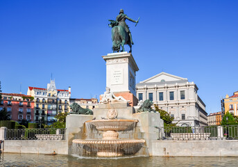 Fountain on Eastern square (Plaza de Oriente) with Royal theatre (Teatro Real) at background, Madrid, Spain