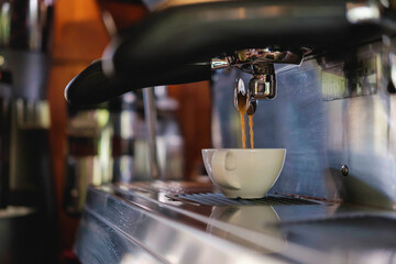  Barista prepares to make coffee with a coffee machine.