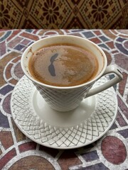 Cup of turkish coffee on the anatolian table and background