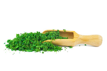 Pile of asafoetida(or hing) with wooden scoop isolated on a white background