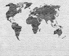 Black and white brick world map on brick wall background