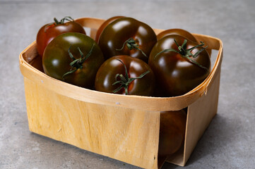 Fresh ripe sweet reddish brown and green kumato tomatoes